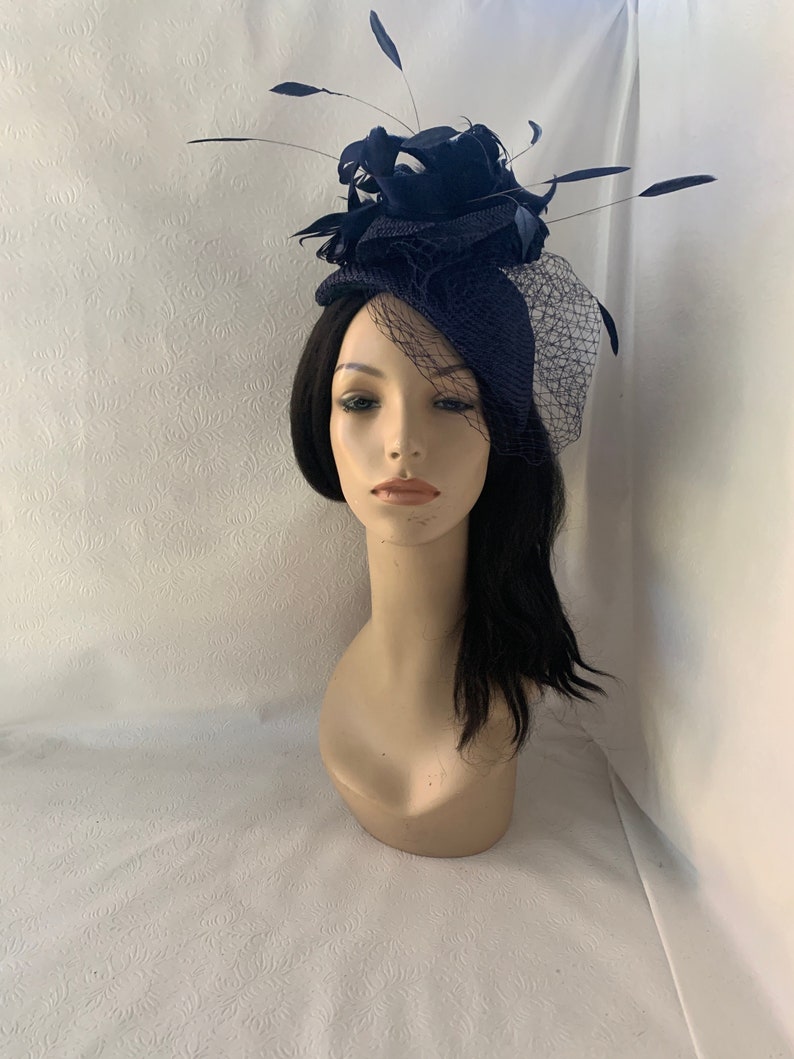 dark navy sinamay wedding half hat with netting veil, long floating feathers and ruffle straw accent