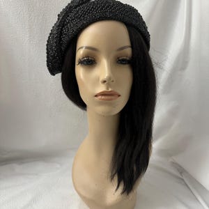 Mannequin wearing a formal all black pearl and rhinestone bejeweled COGIC And COOLIC inspired convocation  women church half hat for convention design as 1950s 1960s half hat