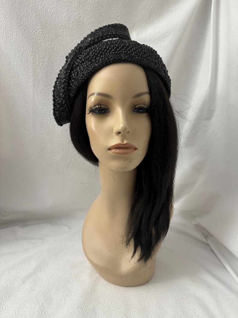 Mannequin wearing a formal all black pearl and rhinestone bejeweled COGIC And COOLIC inspired convocation  women church half hat for convention design as 1950s 1960s half hat