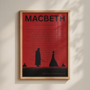 May include: A framed poster featuring a deep red background with the title MACBETH in bold black text. The print includes the text of Scene 1, Act 1 from the play, along with black silhouettes of figures and the author name William Shakespeare.