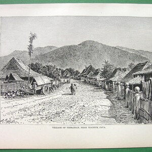 May include: A black and white engraving depicting a village street scene in Thiratan, near Tanjore, Java. The street is lined with simple, thatched-roof houses and a few people are walking along the path. The scene is framed by a mountain range in the background.