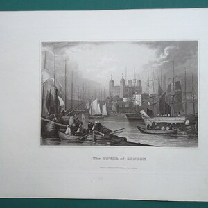May include: A black and white engraving of the Tower of London, a historic castle in London, England. The engraving shows the tower from the river Thames, with several boats in the foreground.