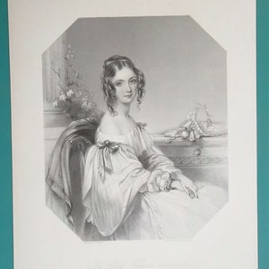 May include: A black and white engraving of a woman in a white dress with a bow at the neckline. She is sitting in a chair with her hands in her lap. The engraving is titled "The Lady Fanny Cole."
