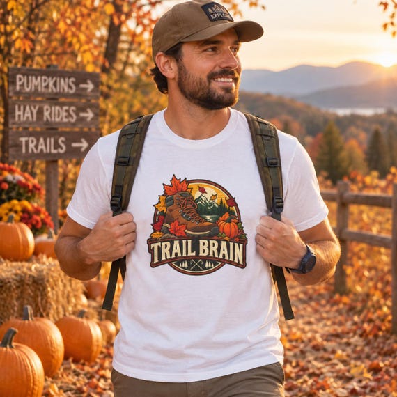 Hiker wearing Trail Brain shirt on autumn trail