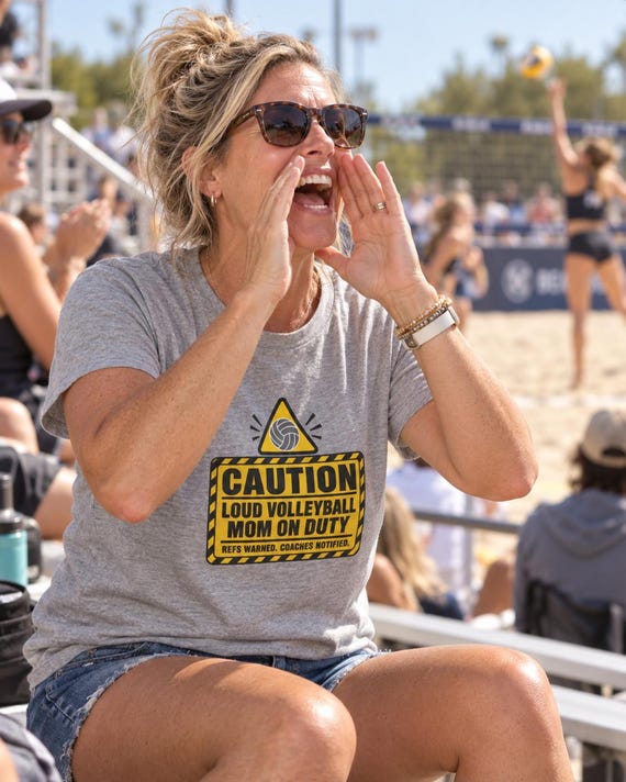 Volleyball mom cheering courtside wearing funny Caution Loud Volleyball Mom tee