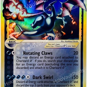 May include: A holographic Charizard Delta Species trading card with 90 HP. The card features a dark blue dragon illustration breathing fire, the attacks Rotating Claws and Dark Swirl, and the text HoloVaultPrints overlaid across the surface.