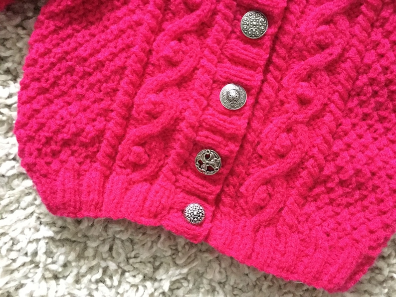 Bright cerise cabled aran cardigan with vintage metal buttons