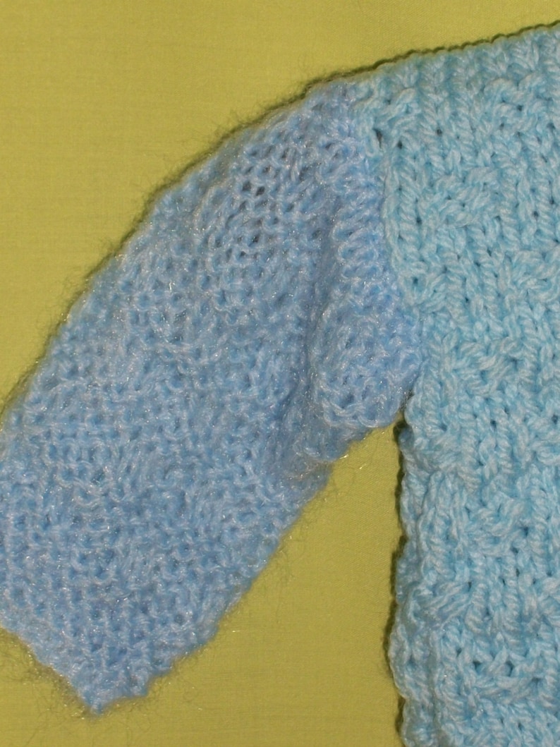 Sale item Blue chunky jumper with cabled patterns for 6 to 9 month old