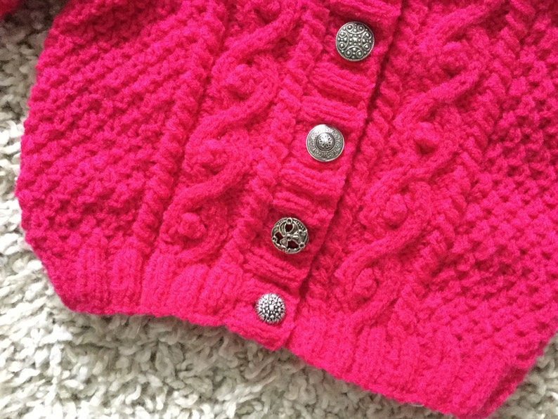 Bright cerise cabled aran cardigan with vintage metal buttons