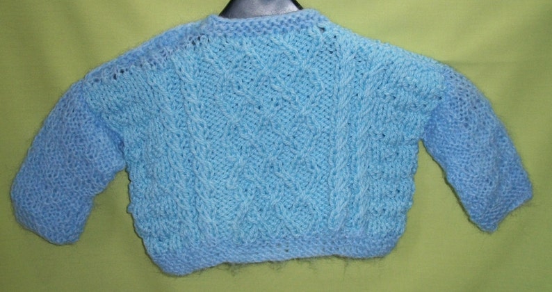 Sale item Blue chunky jumper with cabled patterns for 6 to 9 month old