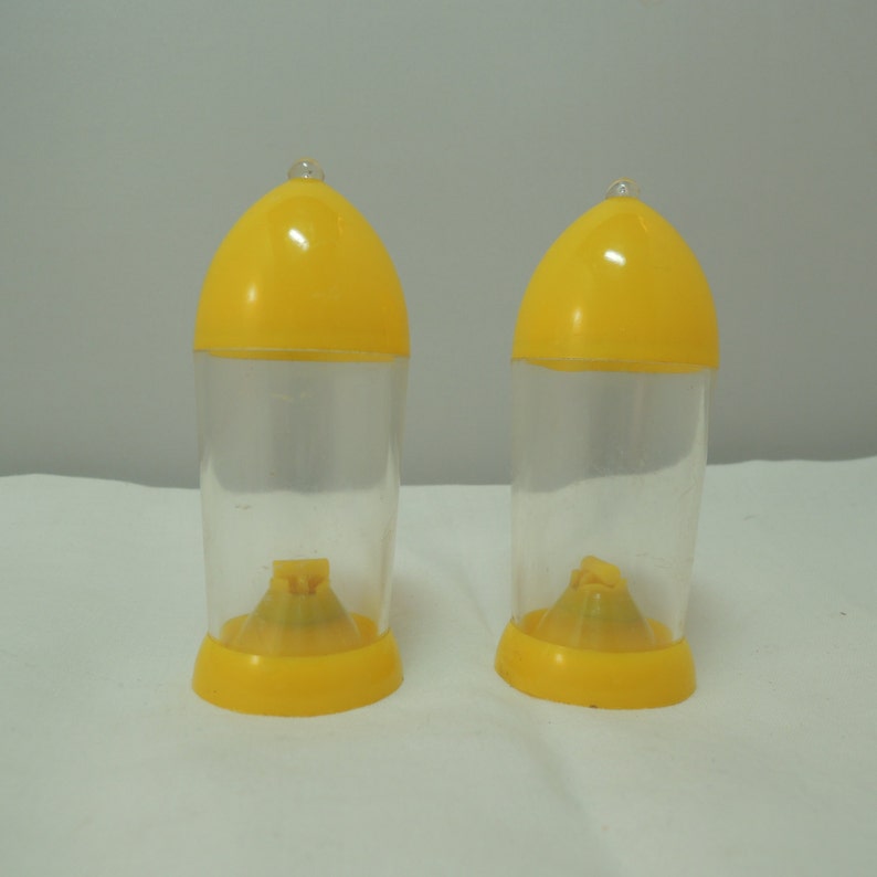 Vintage Bullet shaped Salt and Pepper Shakers Atomic Beautiful condition Yellow and clear plastic