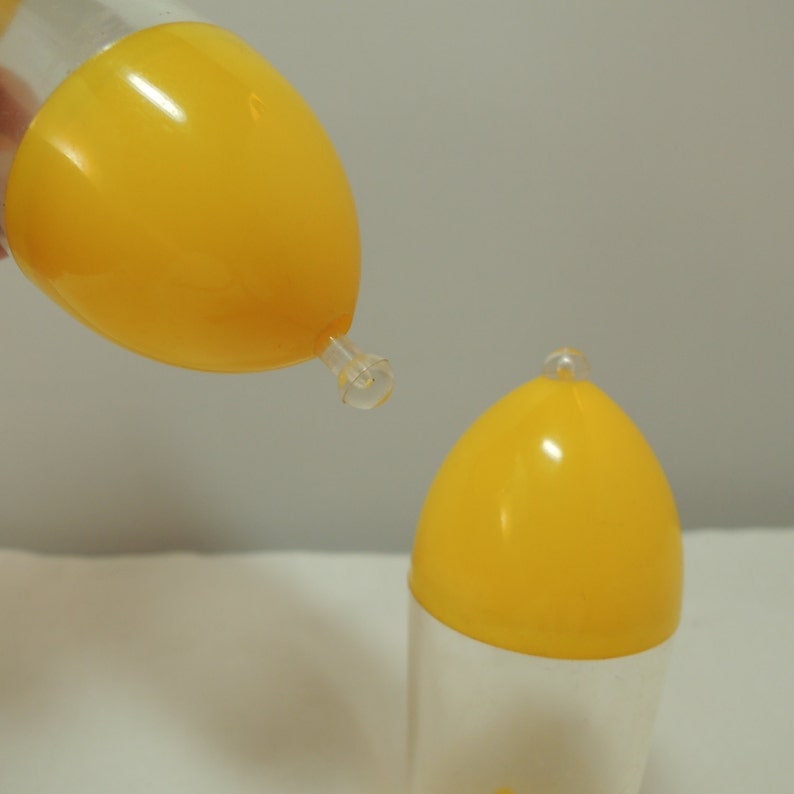 Vintage Bullet shaped Salt and Pepper Shakers Atomic Beautiful condition Yellow and clear plastic