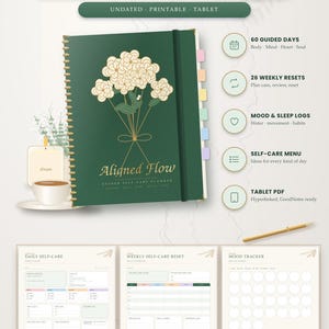 Può includere: Un'agenda per la cura di sé Aligned Flow a spirale verde scuro con un'illustrazione floreale dorata sulla copertina. Include pagine digitali per la cura quotidiana, i reset settimanali e il monitoraggio dell'umore, con PDF per tablet.
