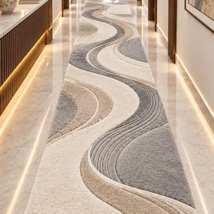 May include: A long rectangular runner rug featuring a textured, abstract wave pattern in shades of cream, beige, and charcoal grey. The design consists of sweeping curved lines and layered sections with varying pile heights, creating a dimensional effect.