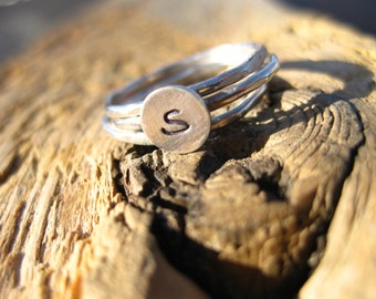3 Sterling stackers with initial