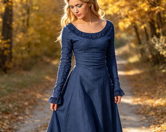 May include: A long-sleeved navy blue dress featuring a scoop neckline with lace trim detailing. The dress has a fitted bodice that transitions into a flared skirt, with matching lace accents on the sleeve cuffs and a textured fabric finish.