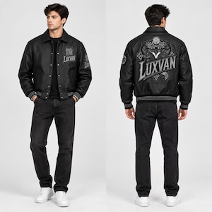 May include: A black leather varsity jacket featuring a button-up front, a collar, and ribbed cuffs. The chest displays the text LUXVAN with a circular emblem. The back features a large graphic of two dragons and the text LUXVAN in bold letters.