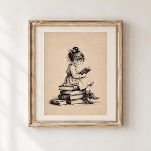 May include: A framed charcoal-style drawing on beige paper depicting a young child with hair tied in a bow, wearing a dress and boots, sitting on a stack of four books while reading an open book held in their hands, rendered in black ink lines.