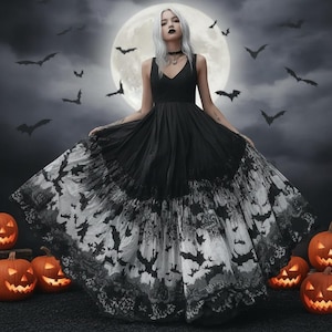 May include: A floor-length black dress with a V-neckline and a wide, flared skirt featuring a detailed monochromatic print of flying bats and intricate lace-like patterns. The bodice is solid black, contrasting with the patterned, voluminous skirt.