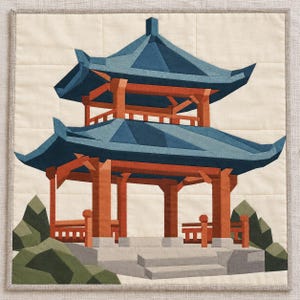 May include: A square fabric quilt wall hanging featuring a pieced design of a two-tiered pagoda structure with blue roofs and orange wooden pillars. The scene includes gray stone steps and green geometric rock formations on a cream background.