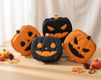 May include: Four pumpkin-shaped bags in orange and black colors. Two bags are orange with black facial features, and two are black with orange facial features. Each bag features a jack-o'-lantern design with eyes, a nose, and a jagged mouth.