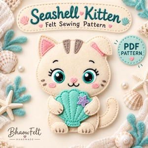 May include: A felt sewing pattern titled Seashell Kitten featuring a cream-colored cat holding a teal seashell with a purple star. The design includes pink cheeks, large teal eyes, and brown ear markings. A circular PDF pattern badge is visible.