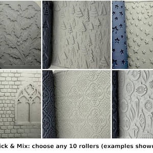 May include: A collection of ten cylindrical clay texture rollers, each featuring distinct embossed patterns including acorns, holly leaves, pine trees, stars, cobblestones, wood grain, brick walls, gothic arches, damask, and ornaments.
