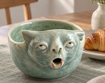 Puking Cat Matcha Bowl, Soft Sage Green Glazed Ceramic Chawan with 3D Sculpted Face and Mouth Spout, Quirky Tea Station Decor for Cat Lovers