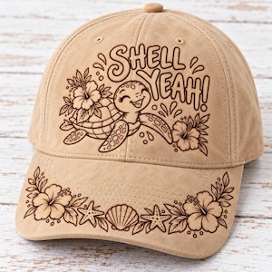 May include: A tan baseball cap featuring a dark brown line art graphic of a smiling sea turtle, hibiscus flowers, and the text "SHELL YEAH!" on the front panel, with additional hibiscus flowers, seashells, and starfish on the brim.