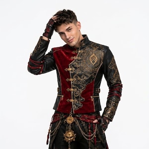 May include: A black and red jacket featuring gold-toned filigree patterns, a high collar, and metallic toggle closures. The sleeves have red cord lacing, and the garment is paired with black trousers adorned with gold chains and a central mask ornament.