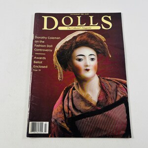 May include: A July/August 1988 issue of DOLLS The Collector's Magazine featuring a portrait of a doll with brown hair wearing a tan bonnet and a plaid shawl. The cover text includes Dorothy Coleman on the Fashion Doll Controversy.