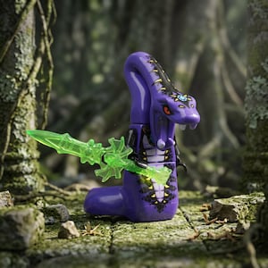 May include: A purple snake-like minifigure with a black and yellow patterned torso and head. The figure features a prominent hood, red eyes, and white fangs. It holds a translucent neon green sword with an intricate, jagged blade design.