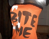 Ladies orange and black tube top halloween with vampire fangs reads "BITE ME"  Size M