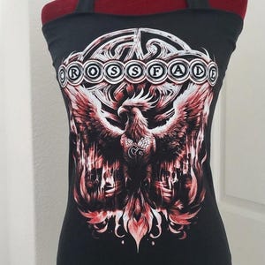May include: Black tank top with a red and white phoenix graphic. The text "CROSSFADE" is printed across the top. The tank top has a halter neck design.
