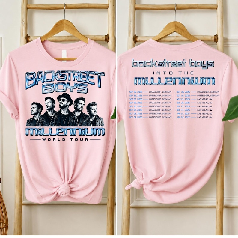 May include: A light pink t-shirt featuring a graphic of the Backstreet Boys with the text Backstreet Boys Millennium World Tour on the front and a list of tour dates and locations including D&uuml;sseldorf and Las Vegas printed on the back.