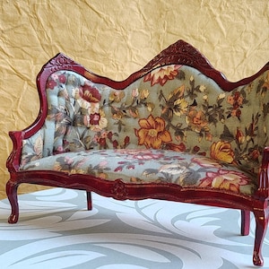 dollhouse Rococo-style parlor sofa mahogany wood finish and a sage-green floral upholstery fabric with curved cabriole legs