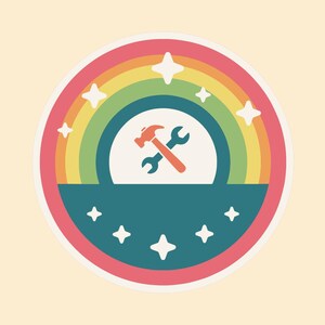 May include: A circular sticker featuring a rainbow arching over a teal semi-circle. In the center, a red hammer and a teal wrench are crossed. The design is accented with white four-pointed stars scattered across the rainbow and the teal base.