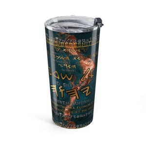 May include: A cylindrical stainless steel tumbler with a clear plastic lid. The exterior features a dark blue background with a textured, copper-colored abstract design and gold-colored text including Genesis, Bereshith, and El Shaddai.