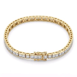 May include: A yellow gold tennis bracelet featuring a continuous row of square-set clear stones. The bracelet is constructed with a series of linked square frames, each holding a stone, and includes a secure box clasp closure mechanism.