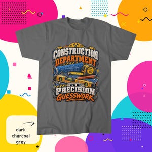 May include: A dark charcoal grey t-shirt featuring a graphic print of construction tools including a blueprint, a tape measure, and a level. The text reads CONSTRUCTION DEPARTMENT WE DO PRECISION GUESSWORK in bold orange, white, and blue lettering.