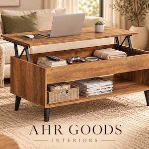 May include: A rectangular wooden lift-top coffee table with a brown wood grain finish, black tapered legs, and an open lower shelf. The top is elevated by a metal mechanism, revealing a storage compartment containing a remote and controller.
