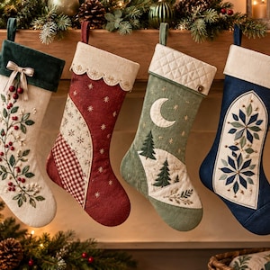 May include: Four Christmas stockings hanging in a row. The first is cream with a green velvet cuff and holly embroidery. The second is red with a scalloped cream cuff and star patterns. The third is sage green with a quilted cuff, moon, and pine trees. The fourth is navy blue with a cream cuff and snowflake embroidery.