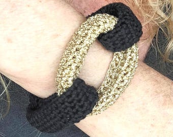 Bracciale rigido intrecciato all'uncinetto nero e oro - Gioielli vistosi e vistosi