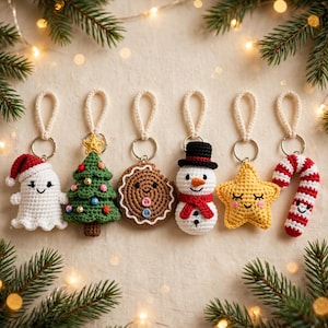 May include: A set of six crocheted keychains featuring a white ghost with a red hat, a green Christmas tree with colourful ornaments, a brown gingerbread cookie, a snowman with a black hat, a yellow star, and a red and white candy cane.