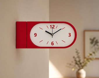 May include: A double-sided wall clock with a red rectangular frame and an oval white face. The clock features red numerals at 3, 6, 9, and 12 o'clock, with red tick marks for the other hours and black hour, minute, and second hands.