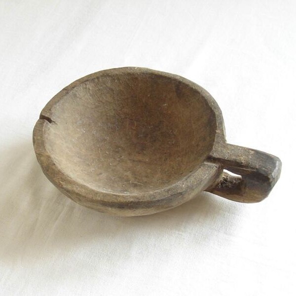 Antique primitive wooden bowl with hanle