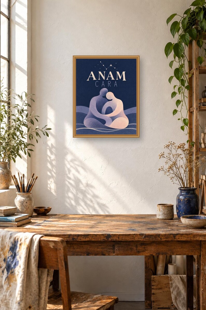 May include: A framed rectangular wall art print featuring a dark blue background with the text ANAM CARA in white capital letters. Below the text, two stylized figures in shades of purple and light pink are shown embracing in a seated position.