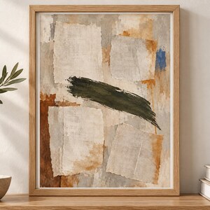 May include: A framed abstract wall art print featuring a collage of torn paper textures in shades of beige, cream, and grey, accented by a bold, horizontal dark green brushstroke and patches of burnt orange and a small spot of bright blue.