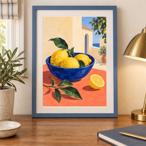 May include: A framed art print featuring a painting of bright yellow lemons in a deep blue bowl on a vibrant orange surface. The scene depicts a Mediterranean-style terrace with a clear blue sky, a stone archway, and green lemon tree foliage.