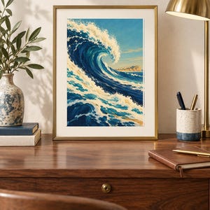 May include: A framed art print featuring a large, curling ocean wave in shades of deep blue, turquoise, and white foam. The painting depicts a dynamic sea scene with a distant rocky coastline under a clear sky, enclosed in a thin gold frame.